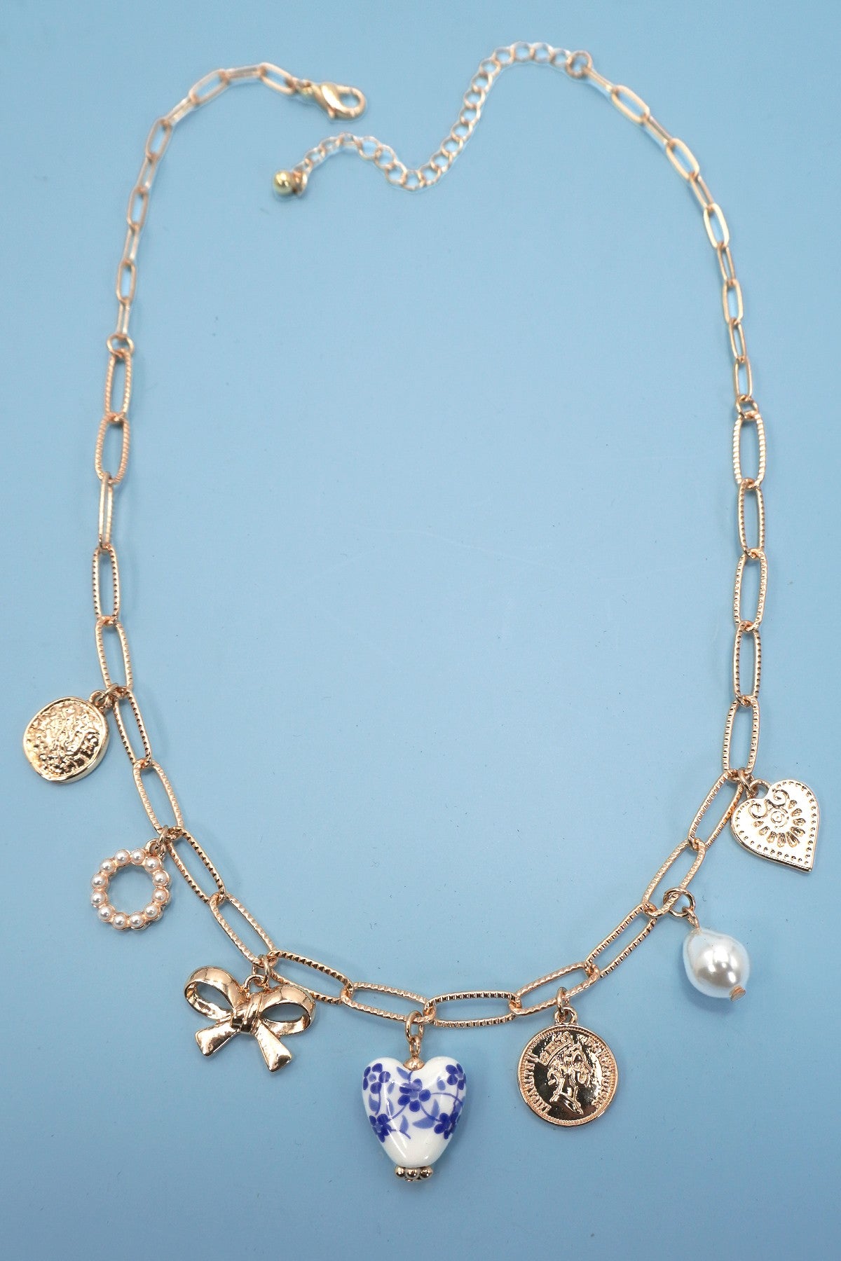 Charm Necklace with Blue Accents and Bows
